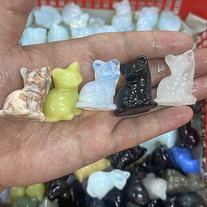 Cute little cat carved from mixed crystals