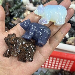 Bear carved from mixed materials crystal