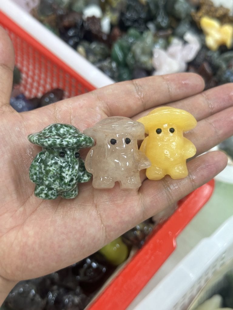 Mushroom man carved from mixed materials crystal